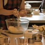 A chef mixing dough learning