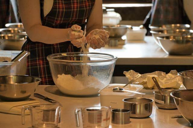 A chef mixing dough learning