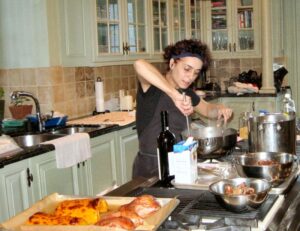 Chef Vanda actively preparing meals in the kitchen