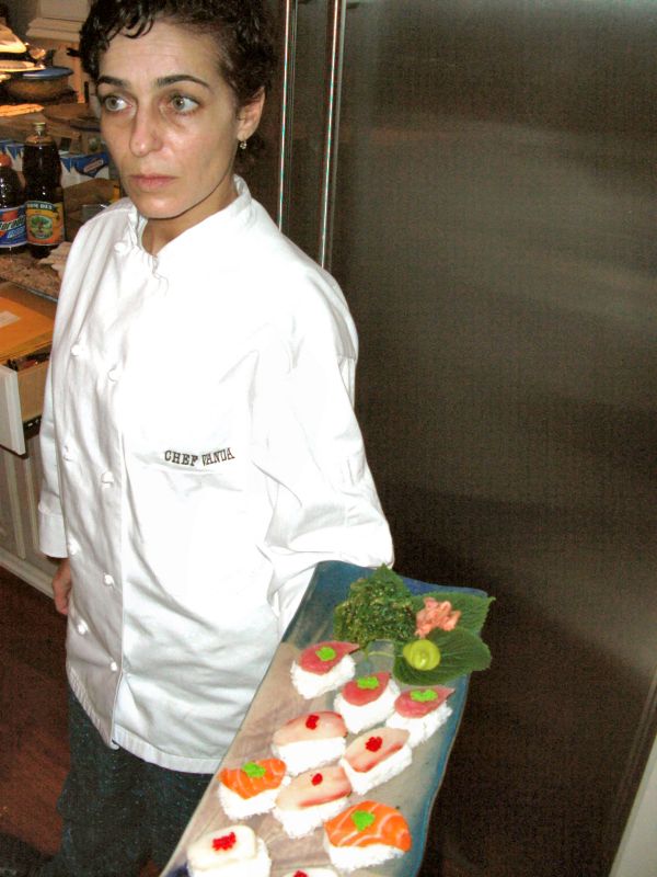 Chef Vanda crafting dishes behind the kitchen line